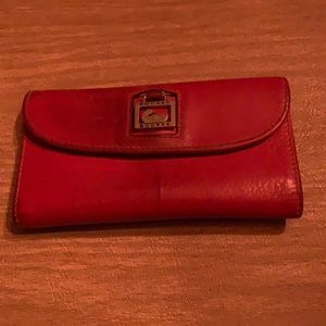 Beautiful Cranberry Dooney & Bourke Wallet with zippered pocket.